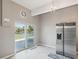 Bright dining area with stainless steel refrigerator and sliding glass doors to backyard patio at 3215 Hibiscus Dr, Hernando Beach, FL 34607
