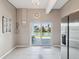 Bright dining area with tile floors and sliding glass doors offering water views at 3215 Hibiscus Dr, Hernando Beach, FL 34607