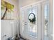 Bright foyer featuring a decorative front door with sidelights at 3215 Hibiscus Dr, Hernando Beach, FL 34607