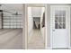 View of a garage with painted concrete floors and doorway to interior of home at 3215 Hibiscus Dr, Hernando Beach, FL 34607