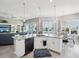 Open concept kitchen with island overlooks living and dining rooms at 3215 Hibiscus Dr, Hernando Beach, FL 34607