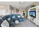 Inviting living room with a large sofa, television, and ample natural light at 3215 Hibiscus Dr, Hernando Beach, FL 34607