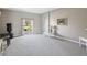 Spacious living room featuring a large window with natural light and neutral decor at 3215 Hibiscus Dr, Hernando Beach, FL 34607