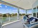 Relax on this spacious porch with comfortable seating and views of the canal at 3215 Hibiscus Dr, Hernando Beach, FL 34607