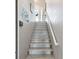 Staircase with painted risers leading to the main level, creating a bright and inviting entrance at 3215 Hibiscus Dr, Hernando Beach, FL 34607