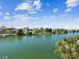 Picturesque water view features waterfront homes and lush greenery under a sunny sky at 3215 Hibiscus Dr, Hernando Beach, FL 34607