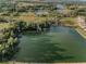 Community aerial showing ponds surrounded by lush greenery, highlighting the tranquil setting of the community at 36419 Flats St, Zephyrhills, FL 33541