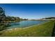 Beautiful backyard with a peaceful water view and lush green lawn, perfect for outdoor enjoyment at 36419 Flats St, Zephyrhills, FL 33541