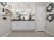 Bright bathroom featuring dual sinks, granite counters, and elegant chandelier lighting at 36419 Flats St, Zephyrhills, FL 33541