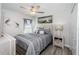 Cozy bedroom with a comfortable bed, soft gray linens, and tasteful decor at 36419 Flats St, Zephyrhills, FL 33541