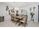 Elegant dining room with a chandelier, stylish decor, and sliding glass doors to the patio at 36419 Flats St, Zephyrhills, FL 33541