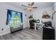 Home office with a ceiling fan, grey flooring, and natural light at 36419 Flats St, Zephyrhills, FL 33541