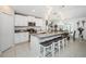 Stylish kitchen featuring white cabinets, granite counters, and a large center island with seating at 36419 Flats St, Zephyrhills, FL 33541