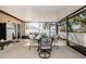 Covered patio with a dining set, perfect for enjoying outdoor meals and gatherings at 36419 Flats St, Zephyrhills, FL 33541