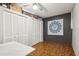 Bedroom with ceiling fan, wood floors and closet with louvered doors at 3741 Appleton Ct, Palm Harbor, FL 34684