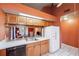 Open kitchen featuring bright countertops, a stainless sink, and view into the living room at 3741 Appleton Ct, Palm Harbor, FL 34684