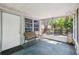 Screened-in lanai with seating and views of the backyard at 3741 Appleton Ct, Palm Harbor, FL 34684
