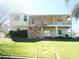 Inviting home exterior with a spacious balcony and well-maintained lawn at 4009 Triggerfish Dr, Hernando Beach, FL 34607