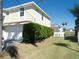 Well-kept home featuring an attached garage and a neatly landscaped yard at 4009 Triggerfish Dr, Hernando Beach, FL 34607