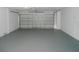 Spacious garage with painted floors and room for parking at 4009 Triggerfish Dr, Hernando Beach, FL 34607