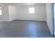 Spacious garage with painted floors, window and entry door at 4009 Triggerfish Dr, Hernando Beach, FL 34607