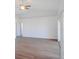 Spacious living room featuring wood floors, sliding glass doors to a patio, and neutral paint at 4009 Triggerfish Dr, Hernando Beach, FL 34607