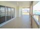 Spacious patio with wood floors and railings at 4009 Triggerfish Dr, Hernando Beach, FL 34607