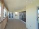 Spacious covered patio with wood floors and railings overlooking the water at 4009 Triggerfish Dr, Hernando Beach, FL 34607