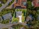 Aerial view of a beautiful home surrounded by lush greenery in a peaceful residential neighborhood at 4237 Marine Pkwy, New Port Richey, FL 34652