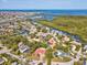 Waterfront home with lush tropical landscaping, situated near the Gulf of Mexico, in a vibrant coastal community at 4237 Marine Pkwy, New Port Richey, FL 34652