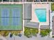 Overhead view of tennis courts, pool, community buildings and parking area at 4237 Marine Pkwy, New Port Richey, FL 34652