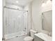 Modern bathroom showcasing a shower/tub combo with glass doors and grey vanity at 4237 Marine Pkwy, New Port Richey, FL 34652