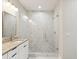 Bathroom featuring a glass shower, granite countertop, double vanity, and modern lighting at 4237 Marine Pkwy, New Port Richey, FL 34652