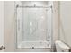 This bathroom boasts a modern glass-enclosed shower with marble tiling and fixtures at 4237 Marine Pkwy, New Port Richey, FL 34652