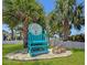 Inviting private beach club for members only, featuring a lifeguard chair surrounded by lush tropical foliage at 4237 Marine Pkwy, New Port Richey, FL 34652