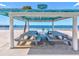 Inviting beachside picnic area with tables, offering a serene spot to relax and enjoy the beautiful ocean views at 4237 Marine Pkwy, New Port Richey, FL 34652