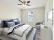 Comfortable bedroom with chic decor, soft lighting, and stylish accents, offering a welcoming personal space at 4237 Marine Pkwy, New Port Richey, FL 34652