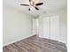The bedroom features wood-look floors, neutral walls, and a closet with bi-fold doors at 4237 Marine Pkwy, New Port Richey, FL 34652