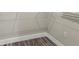 This closet features wood-look floors, a wire rack shelf, and white trim at 4237 Marine Pkwy, New Port Richey, FL 34652