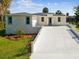 Well-designed one story home with a two-car garage, manicured front yard, and a welcoming entrance at 4237 Marine Pkwy, New Port Richey, FL 34652