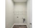 This laundry room has tile floors and a wire rack shelf at 4237 Marine Pkwy, New Port Richey, FL 34652