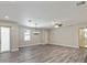 Bright living room with wood flooring and neutral tones, lots of natural light at 4237 Marine Pkwy, New Port Richey, FL 34652