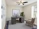 Serene home office featuring a large desk, stylish chair, and soothing decor, perfect for focus and productivity at 4237 Marine Pkwy, New Port Richey, FL 34652
