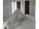 An unfinished bedroom with natural light and two closets at 4557 Garnet Dr # 102, New Port Richey, FL 34652
