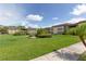 Well-maintained condo community with lush landscaping and mature palm trees at 4557 Garnet Dr # 102, New Port Richey, FL 34652