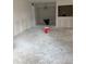 Open-concept living room area with unfinished flooring, ready for customization at 4557 Garnet Dr # 102, New Port Richey, FL 34652