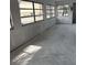 Spacious sunroom area with large windows offering ample natural light at 4557 Garnet Dr # 102, New Port Richey, FL 34652