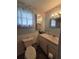 The bathroom has a single sink vanity with mirror, drawers, and a toilet at 5102 Pigeon Plum Cir, New Port Richey, FL 34653