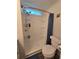 Bathroom featuring a walk-in shower and toilet at 5102 Pigeon Plum Cir, New Port Richey, FL 34653