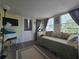 Cozy bedroom with a daybed, lots of natural light, and a television at 5102 Pigeon Plum Cir, New Port Richey, FL 34653